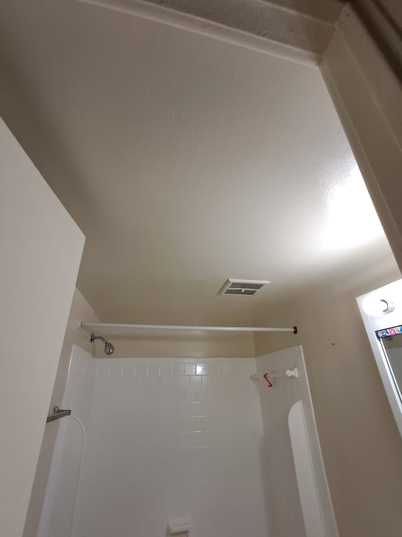 Finished bathroom ceiling and walls after repair and paint