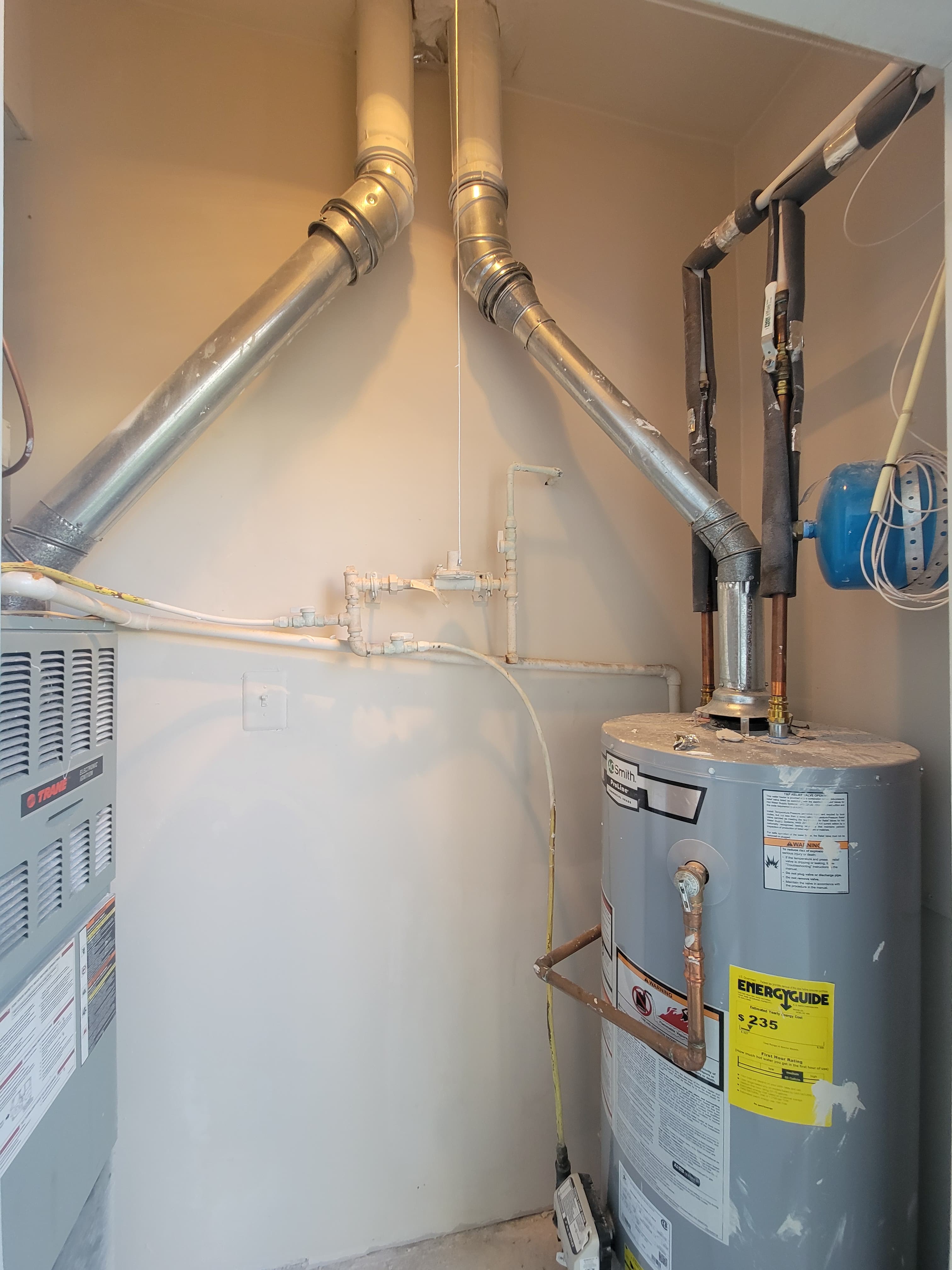 Mechanical room wall repaired and painted after drywall work