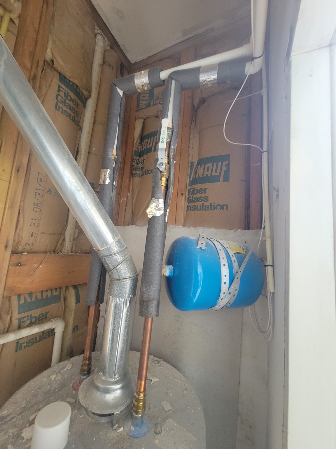 Mechanical room pipes and wall area before enclosure